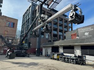 Large lighting rig set up over an alleyway during production of The Bear.